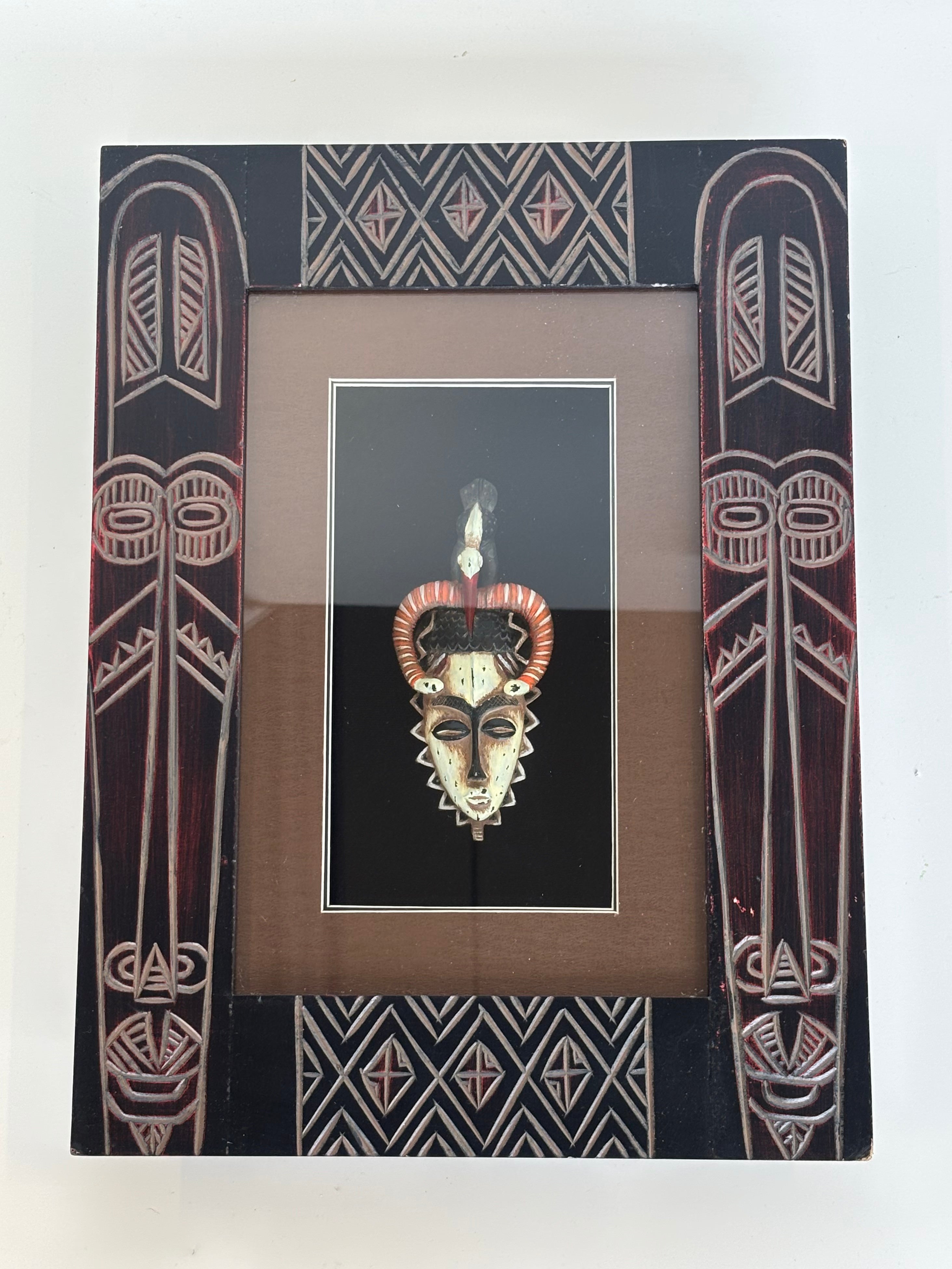 Afrikos genčių kaukė rėmelyje