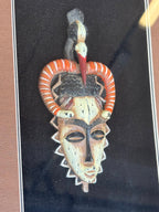 Afrikos genčių kaukė rėmelyje